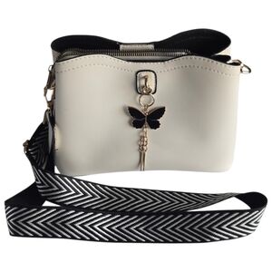 Elegant Cream Crossbody Bag with Black Gold Accents - Butterfly Charm